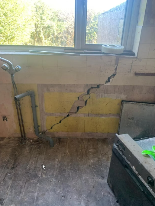 Internal wall and ceiling junction inspected during a structural survey